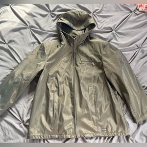 Women’s green jacket.